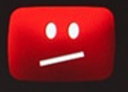 Ein bedrückt dreinschauender Smilie :/ auf rotem Grund, von Youtube früher verwendet.